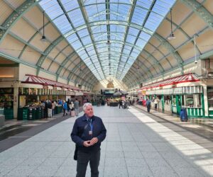 Historic Newcastle street with sandstone architecture and market atmosphere
