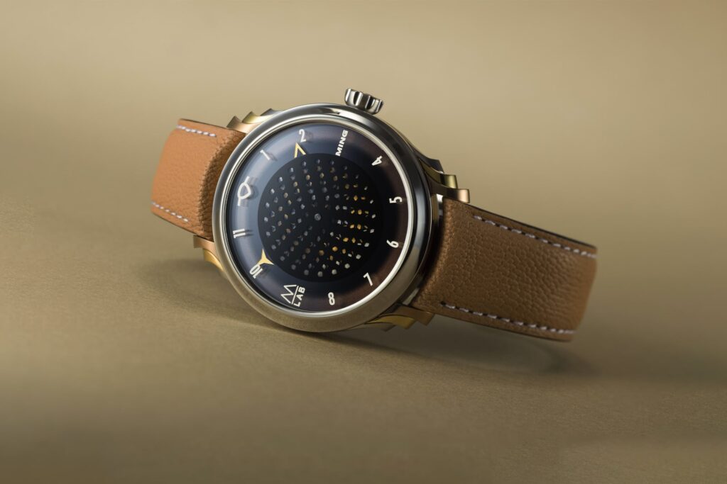 Ming and Massena LAB Bring Motion to the Honeycomb Dial Ming x Massena LAB 57.09 Secret Honey with moving honeycomb dial and three-tone titanium lugs