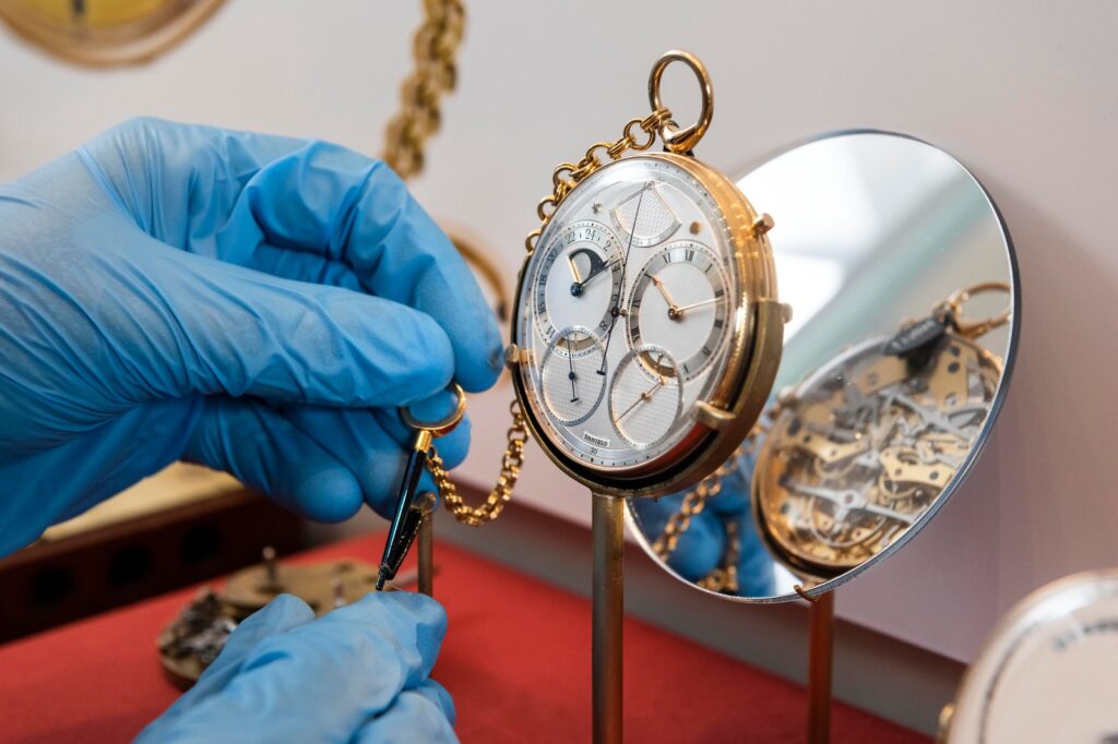 Five Sidereal Time Watches That Kept Their Eyes on the Stars Vintage sidereal time watches and chronographs arranged on a celestial star chart