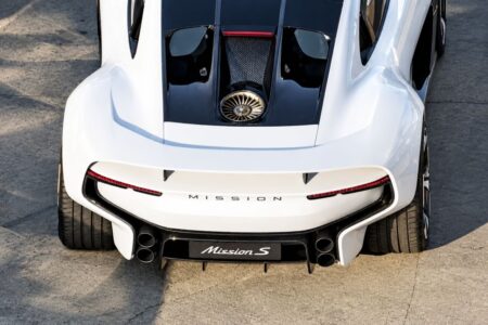 Porsche Mission S Concept Breaks Cover Before Its Official Debut Leaked rear view of the Porsche Mission S concept showing glass roof panels, wide fenders and stacked quad exhausts