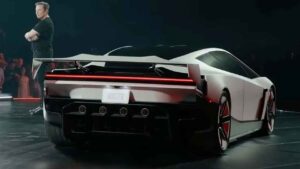Tesla Roadster electric performance car concept on a dark studio background