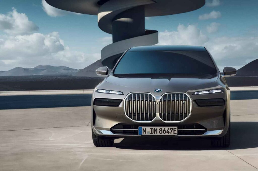 BMW i7 luxury electric sedan driving on a modern road