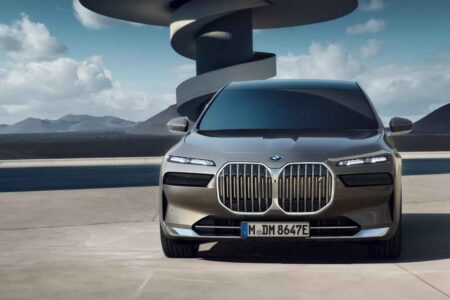 BMW i7 Gains Range Through Efficiency, Not a Bigger Battery BMW i7 luxury electric sedan driving on a modern road