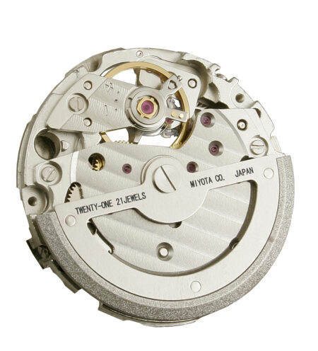 Close-up of a mechanical watch movement on a watchmaker’s bench representing Miyota calibers used in microbrand watches