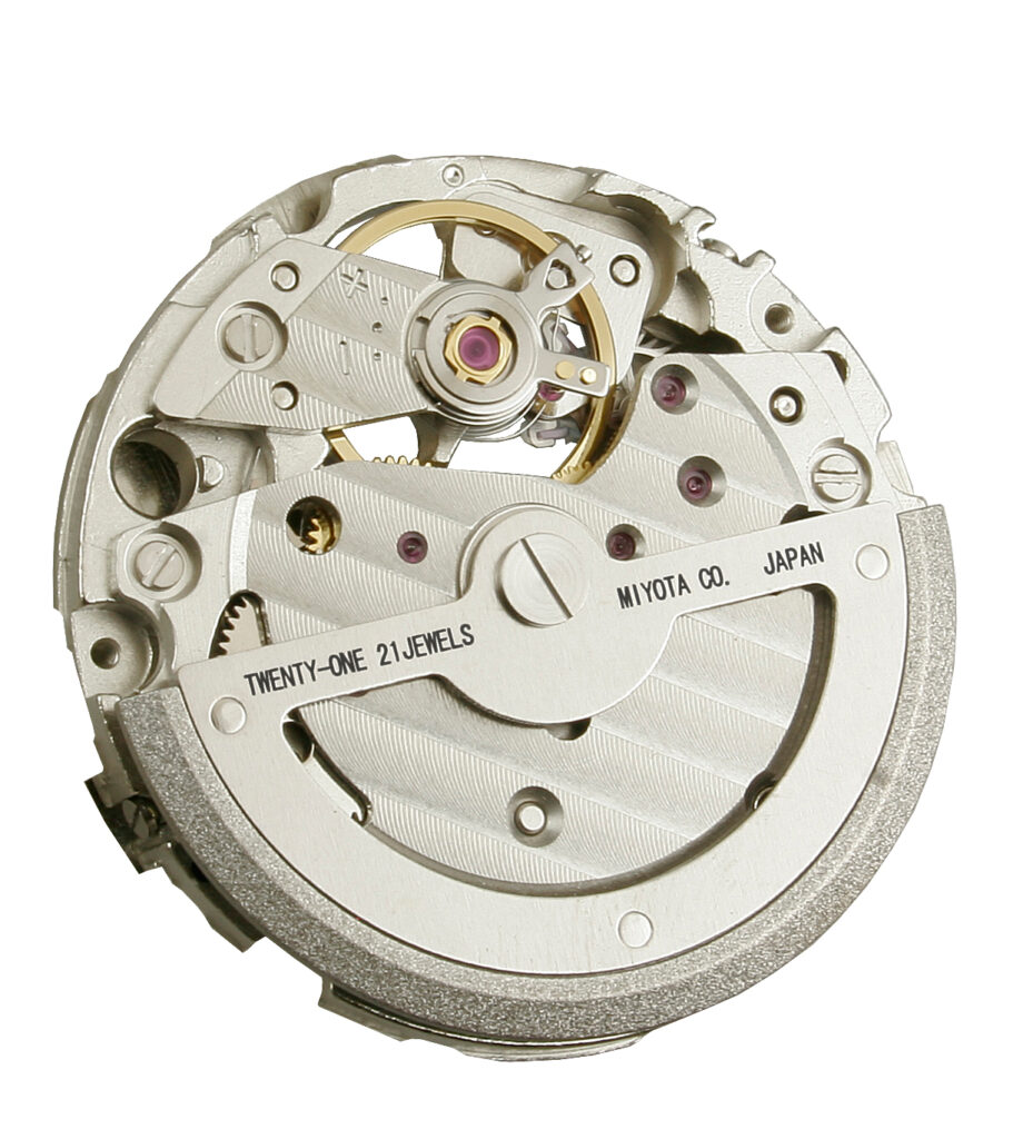 Close-up of a mechanical watch movement on a watchmaker’s bench representing Miyota calibers used in microbrand watches