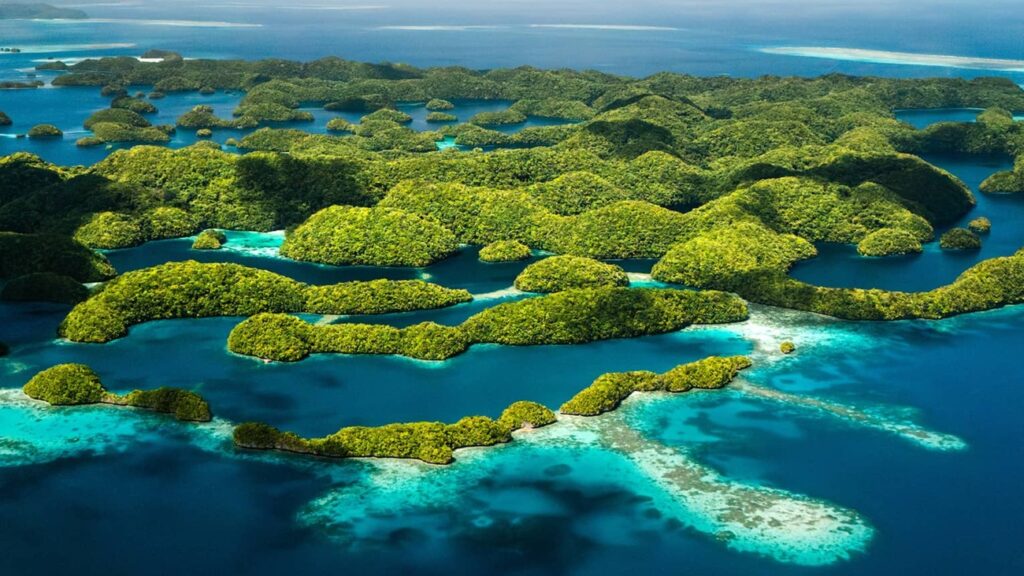 Aerial view of Palau’s Rock Islands surrounded by turquoise lagoon water