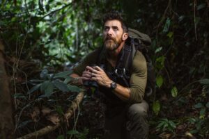 Aldo Kane wearing a Bremont watch in a rugged expedition setting