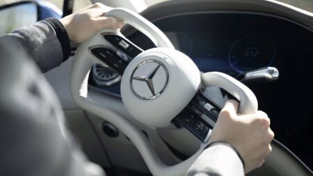 Mercedes Is Patenting a Steering Wheel That Can Change Size Conceptual adjustable Mercedes-Benz steering wheel inside a modern car cabin