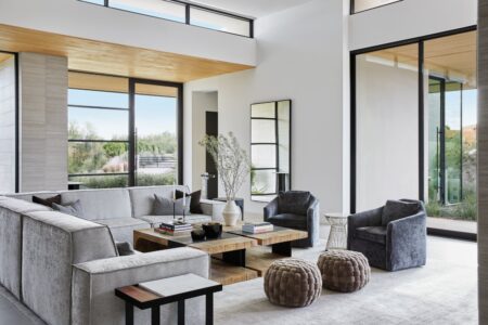 Designing Tactile Luxury Into Everyday Interiors A refined living room with wool carpet, linen curtains, timber furniture and layered tactile materials
