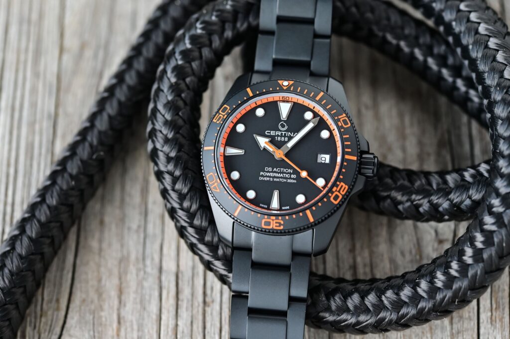 Certina DS Action Diver 38mm Black PVD with orange and teal accent versions