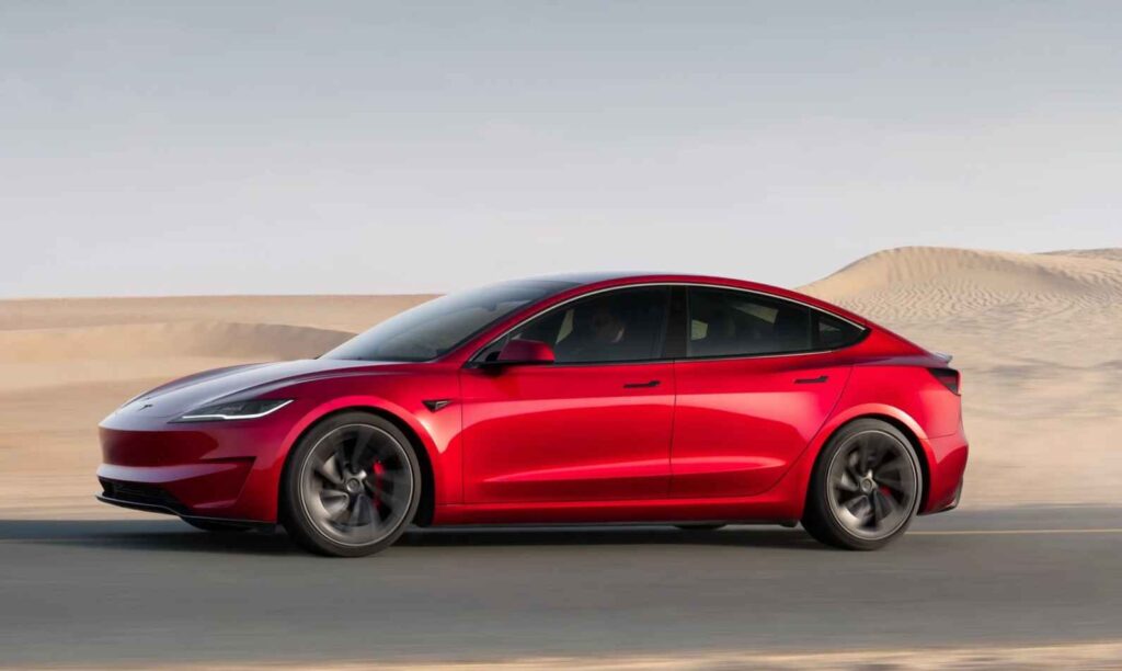 Tesla Model 3 and Model Y electric cars parked in a modern Australian setting