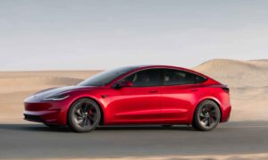 Tesla Model 3 and Model Y electric cars parked in a modern Australian setting