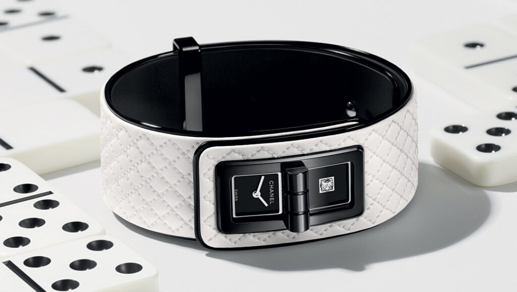 Chanel Code Coco Game Turns Timekeeping Into a Private Gesture Chanel Code Coco Game limited-edition cuff watch with white leather bracelet and black lacquer dial detail