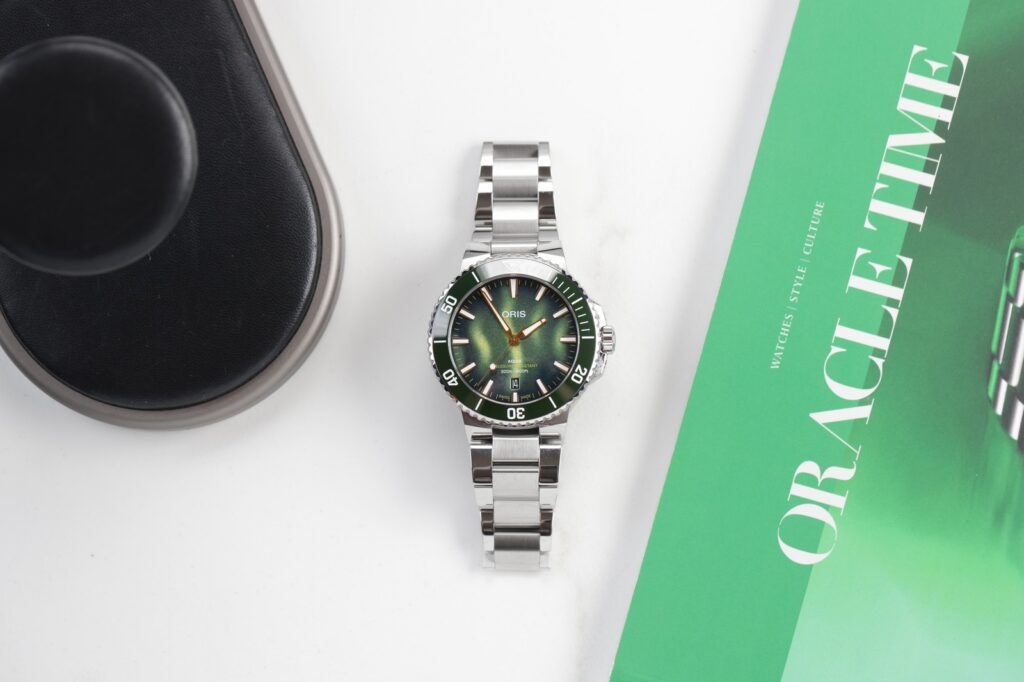 Oris Gives the Aquis Date a Kelp Forest Dial With a Conservation Message Oris Aquis Date Kelp Forest Limited Edition with green 3D-printed dial and stainless steel bracelet