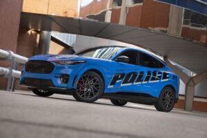 2027 Ford Mustang Mach-E Adds Its First Factory-Built SSV Model 2027 Ford Mustang Mach-E Special Service Vehicle electric crossover in a studio-style front three-quarter view