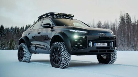 Conceptual rugged Audi SUV on an off-road trail in a forest setting