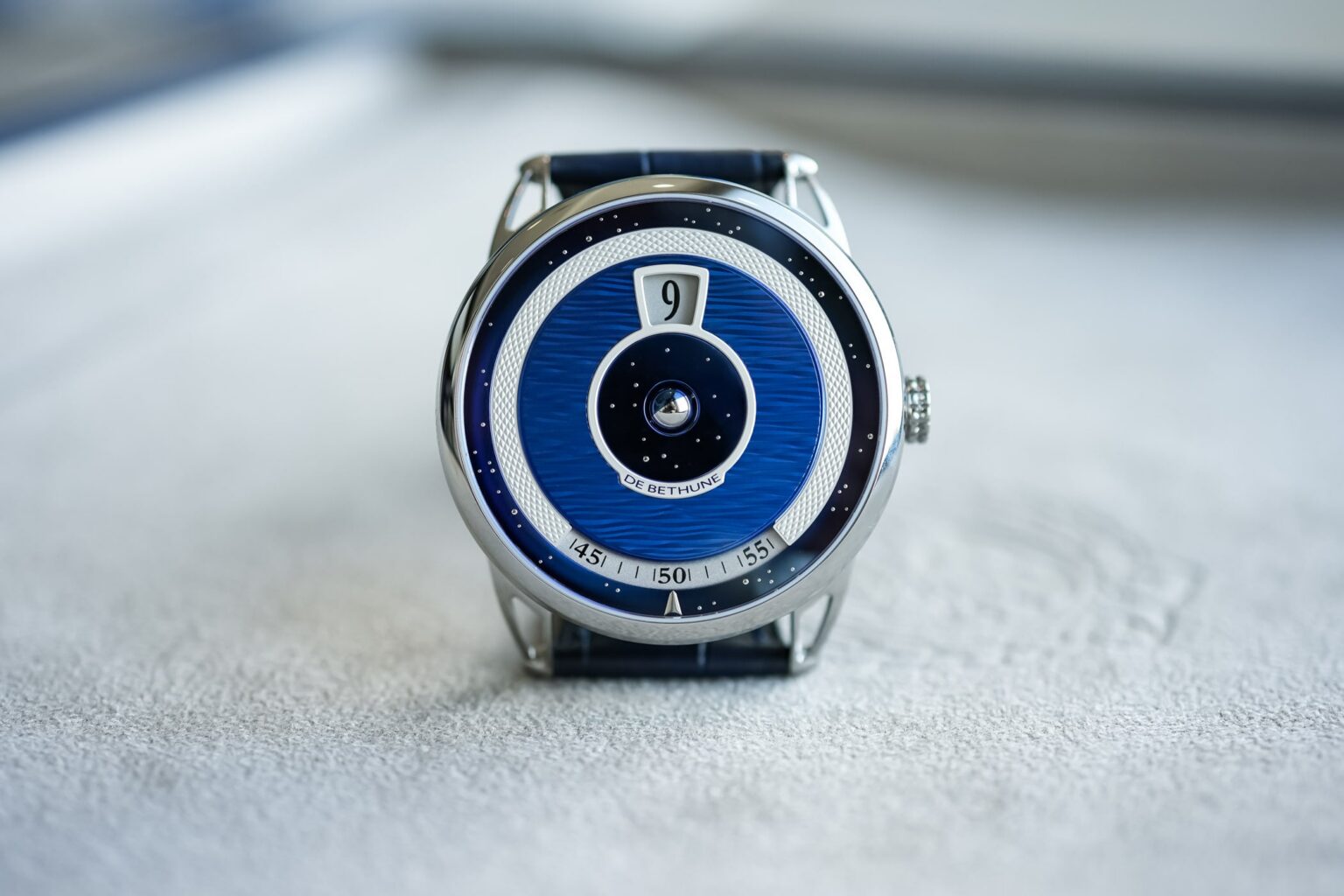 De Bethune’s DB25 Digitale Recasts the Jumping Hour for a Sharper Era De Bethune DB25 Digitale with blued titanium dial and spherical moon phase