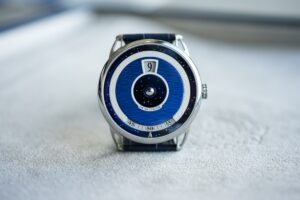 De Bethune’s DB25 Digitale Recasts the Jumping Hour for a Sharper Era De Bethune DB25 Digitale with blued titanium dial and spherical moon phase