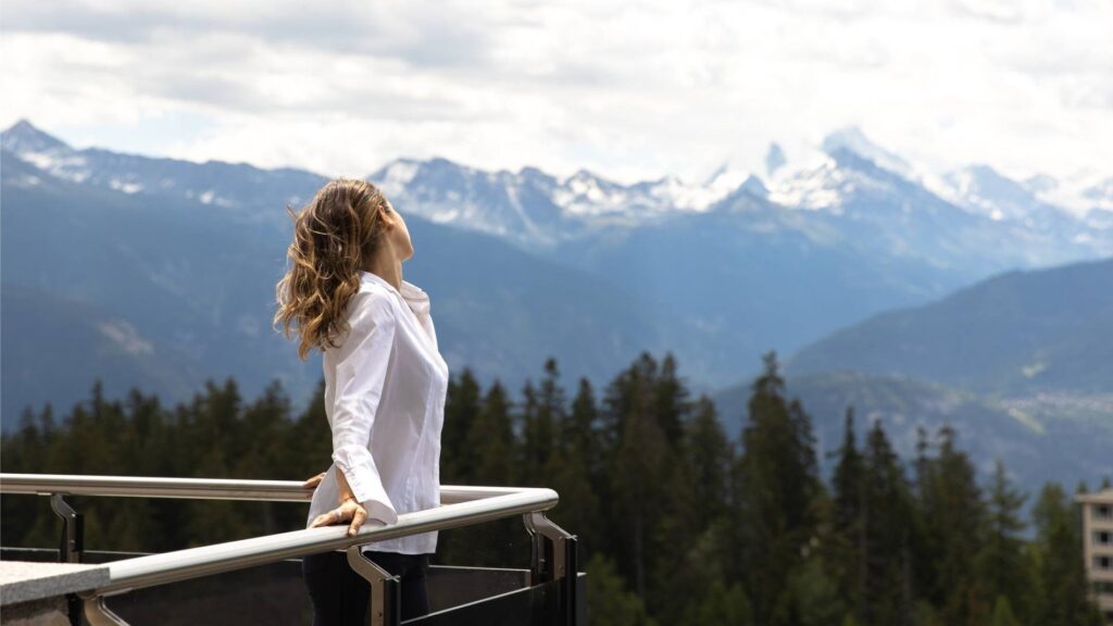 Crans Ambassador Makes a Strong Case for Staying In Above Crans-Montana Ambassador Suite terrace at Crans Ambassador overlooking the Swiss Alps in Crans-Montana